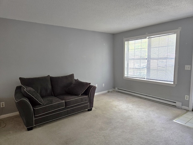 745 Merrow Rd Unit 139, Coventry, CT 06238 - carpeted living area featuring baseboard heating, a textured ceiling, and baseboards