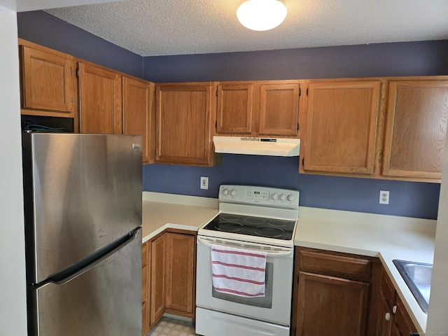 745 Merrow Rd Unit 139, Coventry, CT 06238 - kitchen featuring freestanding refrigerator, white range with electric stovetop, under cabinet range hood, light countertops, and a textured ceiling