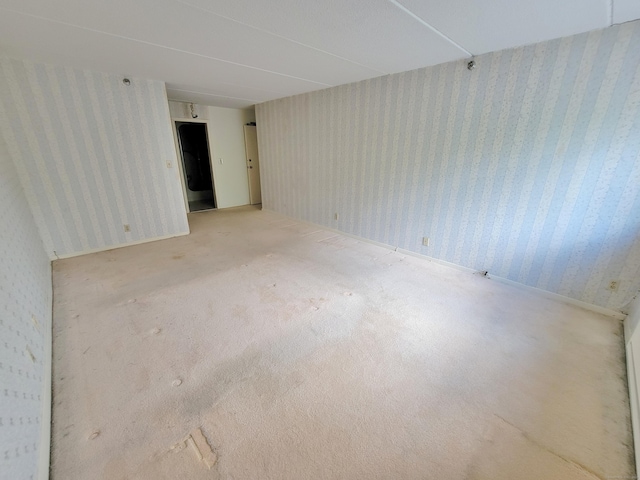 143 Hoyt St Apt 1F, Stamford, CT 06905 - unfurnished room with wallpapered walls and carpet floors
