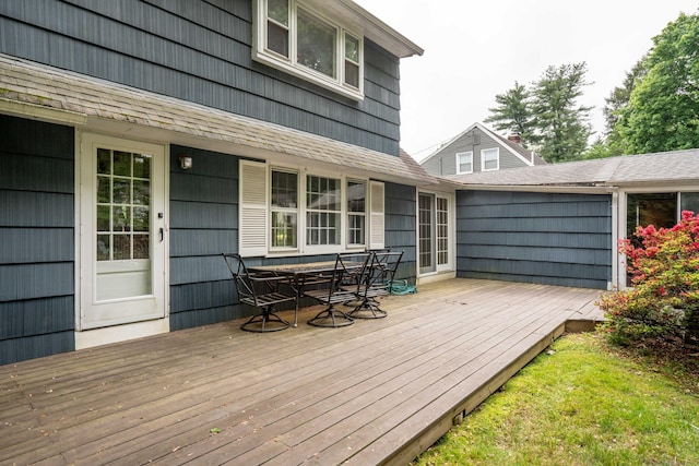 wooden terrace with outdoor dining area