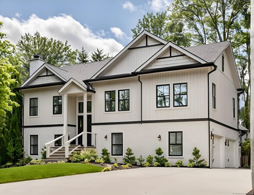 390 Ash Swamp Rd, Glastonbury, CT 06033 - view of front facade featuring a garage, a chimney, driveway, and a shingled roof