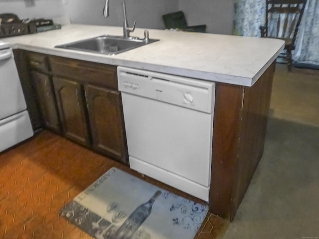 kitchen with dishwashing machine, a sink, light countertops, a peninsula, and dark brown cabinets