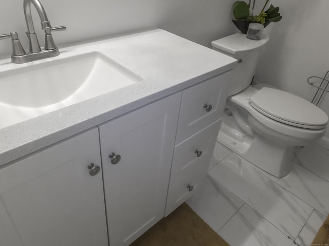 half bath featuring vanity, toilet, and tile patterned floors