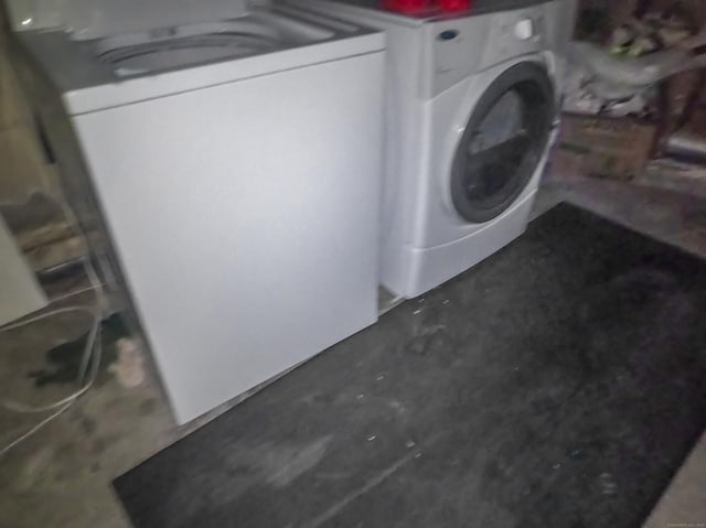 clothes washing area featuring washer / dryer
