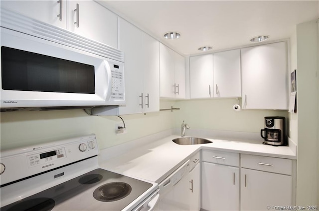 60 Strawberry Hill Ave Unit 1118, Stamford, CT 06902 - kitchen with white appliances, a sink, and white cabinets