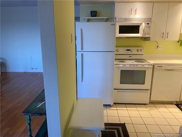 60 Strawberry Hill Ave Unit 1118, Stamford, CT 06902 - kitchen with white appliances, white cabinetry, light countertops, and light tile patterned flooring