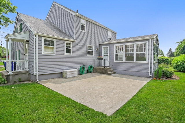 67 Matthew Dr, Stratford, CT 06614 - rear view of house featuring a lawn, a patio, and a shingled roof