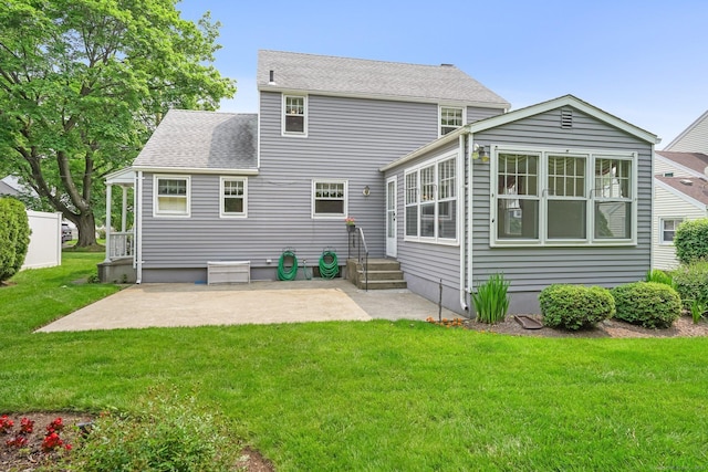 67 Matthew Dr, Stratford, CT 06614 - back of property with a patio area, a yard, a shingled roof, and entry steps