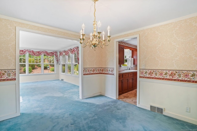 67 Matthew Dr, Stratford, CT 06614 - spare room with wallpapered walls, a wainscoted wall, a chandelier, crown molding, and light colored carpet