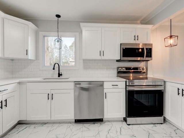 37 Austin Rd, Durham, CT 06422 - kitchen with stainless steel appliances, a sink, ornamental molding, decorative backsplash, and white cabinetry