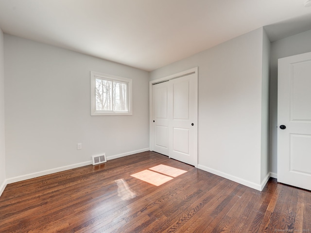 37 Austin Rd, Durham, CT 06422 - unfurnished bedroom featuring wood finished floors, baseboards, and a closet