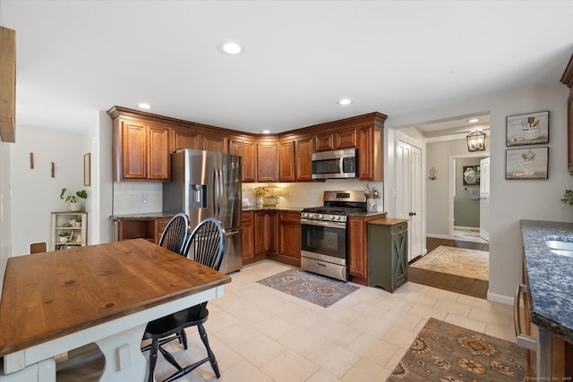 123 Kennerson Reservoir Rd, Ashford, CT 06278 - kitchen with appliances with stainless steel finishes, tasteful backsplash, recessed lighting, baseboards, and light tile patterned flooring