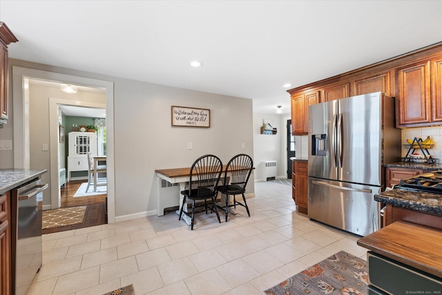 123 Kennerson Reservoir Rd, Ashford, CT 06278 - kitchen with appliances with stainless steel finishes, radiator heating unit, recessed lighting, baseboards, and brown cabinetry