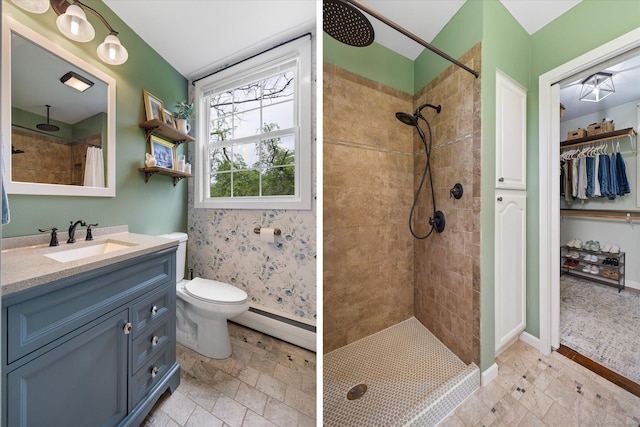 123 Kennerson Reservoir Rd, Ashford, CT 06278 - full bath featuring a baseboard heating unit, a tile shower, vanity, toilet, and baseboards