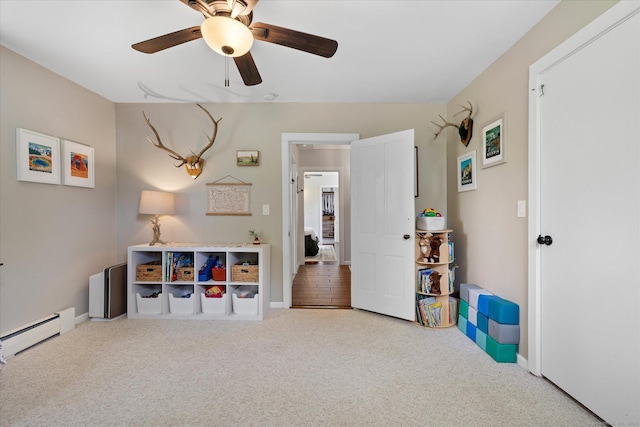 123 Kennerson Reservoir Rd, Ashford, CT 06278 - playroom with carpet floors, a ceiling fan, baseboards, and a baseboard radiator