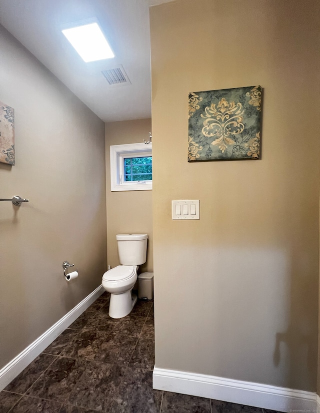 41 Secret Lake Rd, Canton, CT 06019 - bathroom with toilet and baseboards