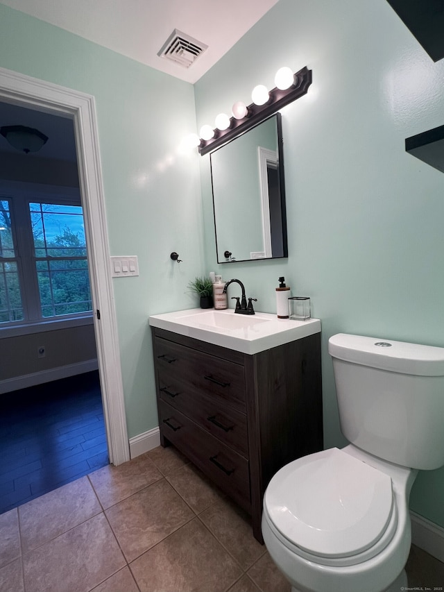 41 Secret Lake Rd, Canton, CT 06019 - half bathroom featuring toilet, vanity, baseboards, and tile patterned floors