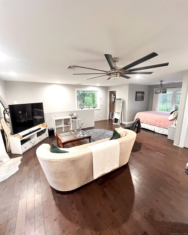 41 Secret Lake Rd, Canton, CT 06019 - living area with dark wood finished floors and ceiling fan