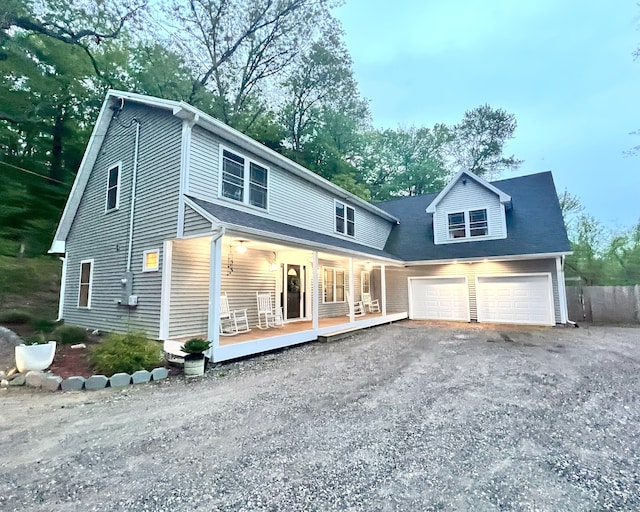 41 Secret Lake Rd, Canton, CT 06019 - back of house with covered porch, a garage, and asphalt driveway