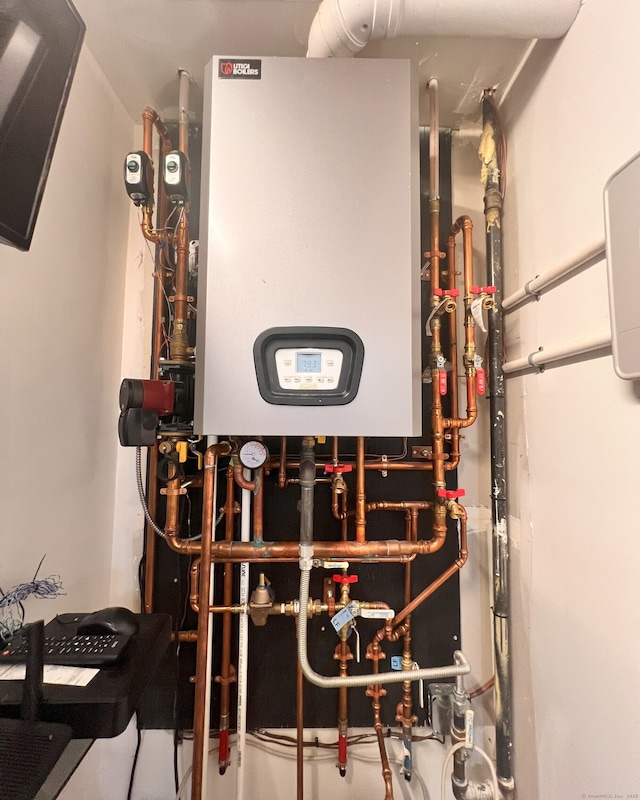 41 Secret Lake Rd, Canton, CT 06019 - utility room with tankless water heater