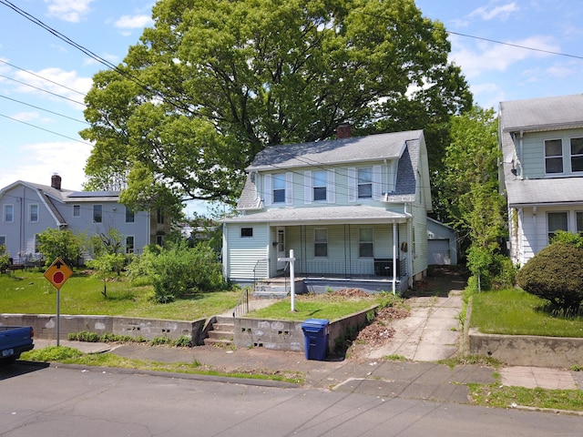 75 Clifton St, West Haven, CT 06516 - view of front facade with a porch, a detached garage, roof with shingles, and a chimney