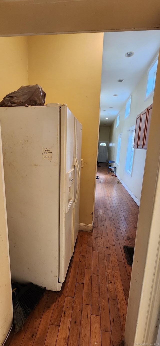 75 Clifton St, West Haven, CT 06516 - laundry room with wood-type flooring and baseboards