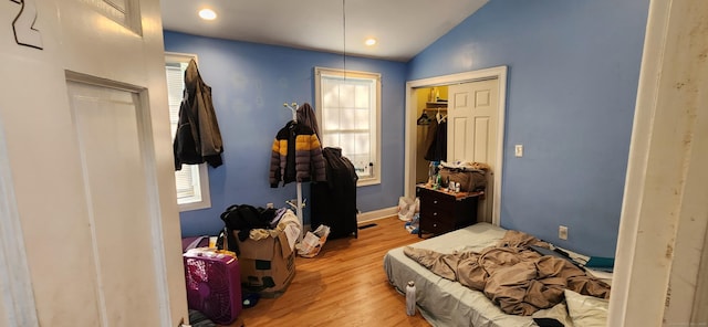 75 Clifton St, West Haven, CT 06516 - bedroom featuring lofted ceiling, wood finished floors, a closet, and baseboards