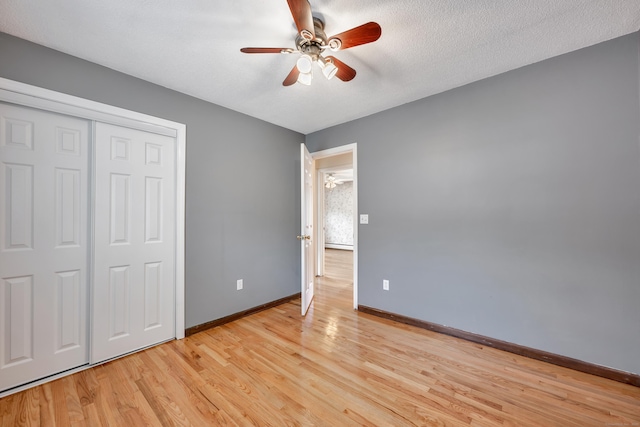 154 Williamson Dr, Waterbury, CT 06710 - unfurnished bedroom featuring light wood finished floors, baseboards, a closet, and ceiling fan