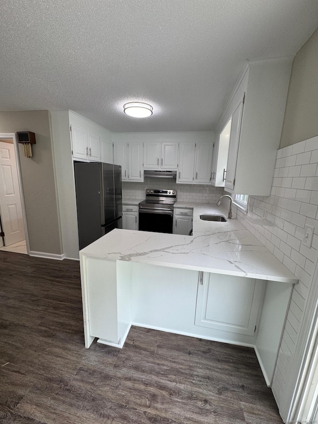 222 W Main St Apt 1C, Southington, CT 06479 - kitchen with stainless steel range with electric cooktop, freestanding refrigerator, a sink, a peninsula, and exhaust hood