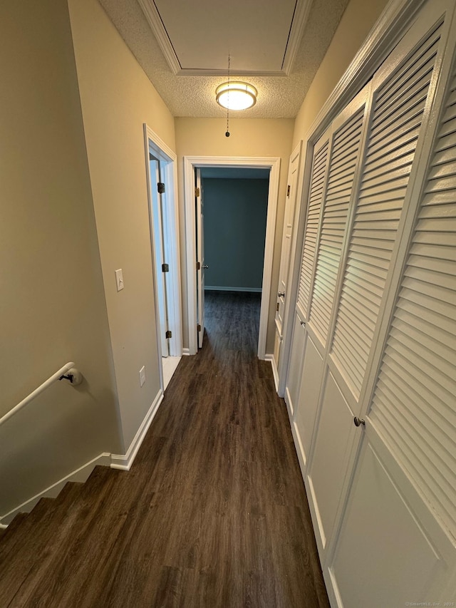 222 W Main St Apt 1C, Southington, CT 06479 - corridor featuring attic access, dark wood-style flooring, baseboards, and a textured ceiling