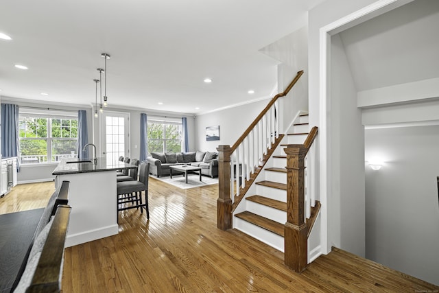 81 Tucker St Unit 81, Danbury, CT 06810 - stairway featuring healthy amount of natural light, wood finished floors, recessed lighting, and ornamental molding