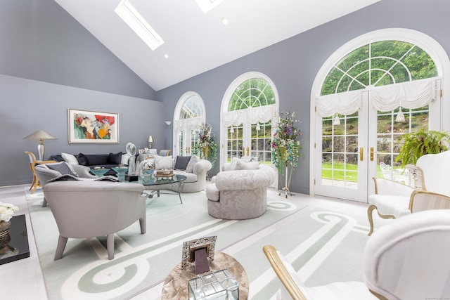 living area with french doors, high vaulted ceiling, a skylight, recessed lighting, and carpet floors