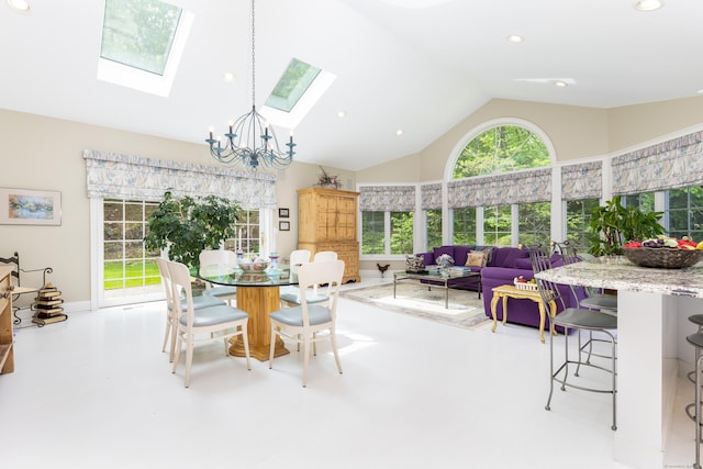dining space with a chandelier, a skylight, high vaulted ceiling, recessed lighting, and concrete flooring