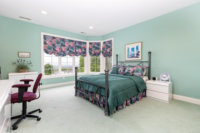 carpeted bedroom with baseboards, recessed lighting, and an office area