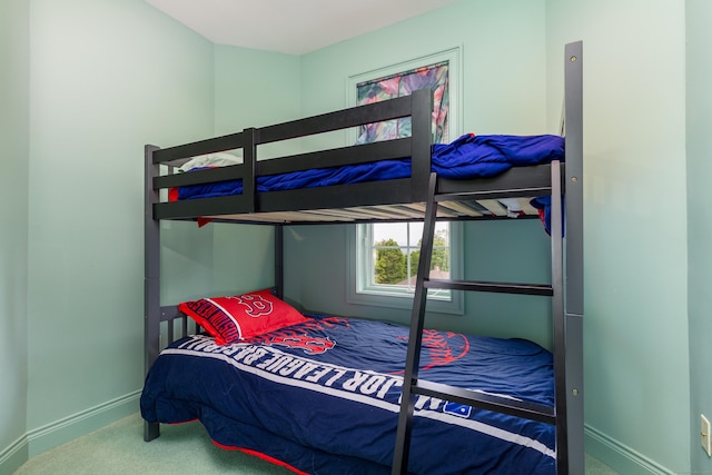 carpeted bedroom with baseboards