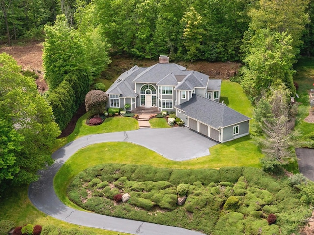 view from above of property with a forest
