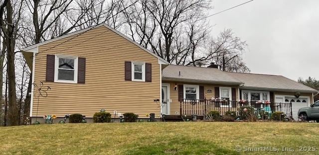 15 Kings Hwy, North Haven, CT 06473 - split level home with an attached garage, a front yard, and a chimney