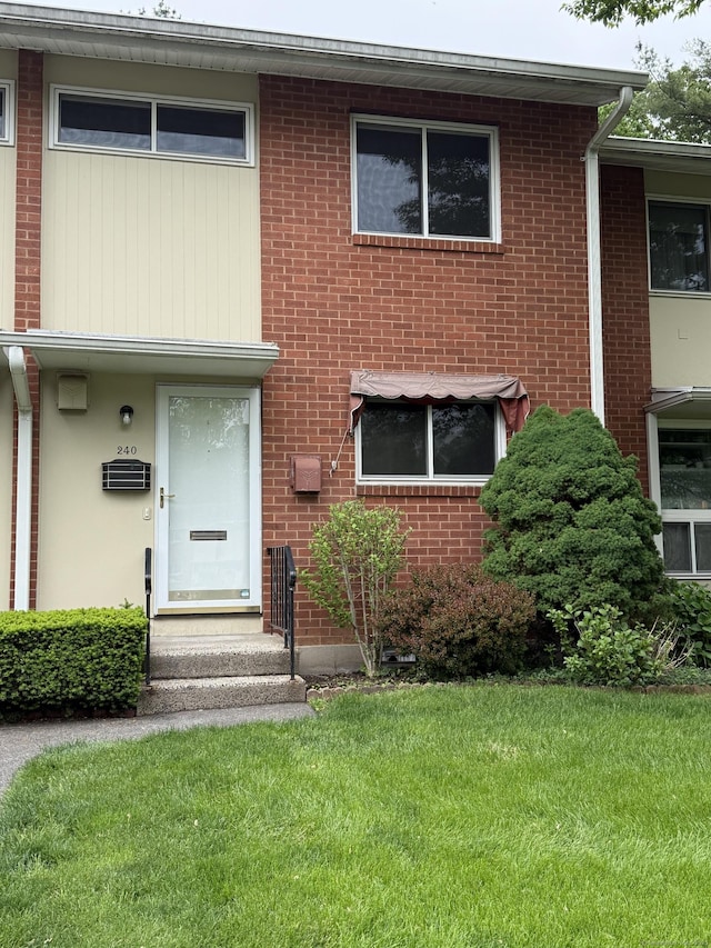 240 Centerbrook Rd Unit 240, Hamden, CT 06518 - view of front facade with a front lawn and brick siding