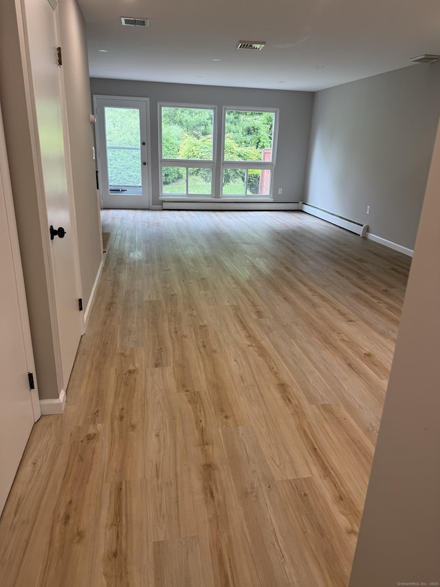 240 Centerbrook Rd Unit 240, Hamden, CT 06518 - unfurnished room with a baseboard heating unit, light wood finished floors, and baseboards
