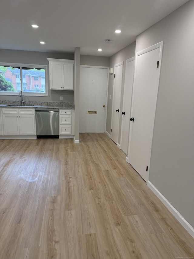 240 Centerbrook Rd Unit 240, Hamden, CT 06518 - kitchen with stainless steel dishwasher, light wood-style floors, a sink, white cabinetry, and recessed lighting