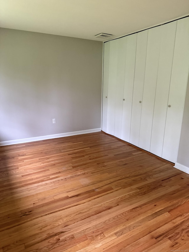 240 Centerbrook Rd Unit 240, Hamden, CT 06518 - unfurnished bedroom featuring light wood-style flooring, baseboards, and a closet