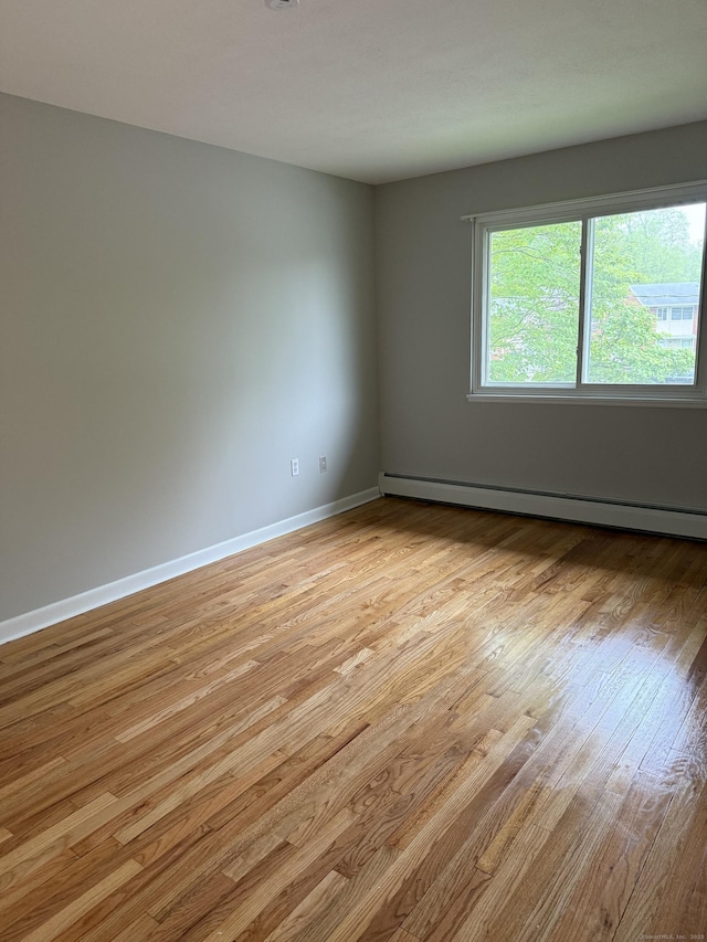 240 Centerbrook Rd Unit 240, Hamden, CT 06518 - unfurnished room featuring baseboard heating, light wood-type flooring, and baseboards