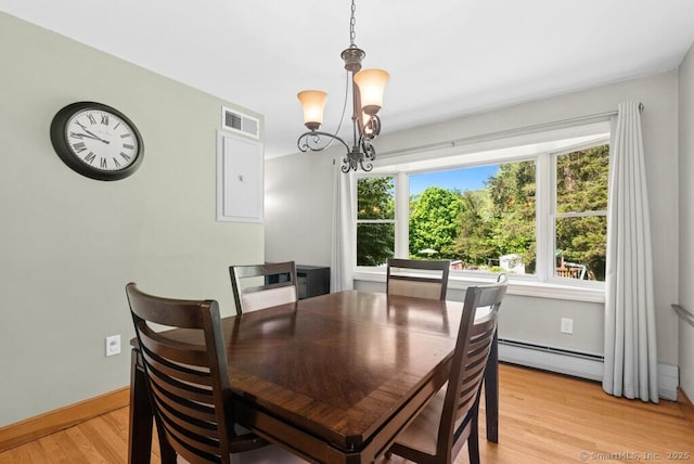 26 Thorson Rd, Oxford, CT 06478 - dining area featuring a chandelier, a baseboard heating unit, light wood-style flooring, and baseboards