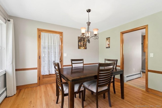 26 Thorson Rd, Oxford, CT 06478 - dining room featuring a baseboard radiator, a chandelier, light wood-style flooring, and baseboards