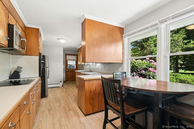 26 Thorson Rd, Oxford, CT 06478 - kitchen with stainless steel microwave, black electric stovetop, and brown cabinets