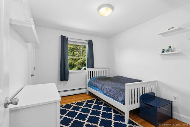 26 Thorson Rd, Oxford, CT 06478 - bedroom featuring baseboard heating and wood finished floors
