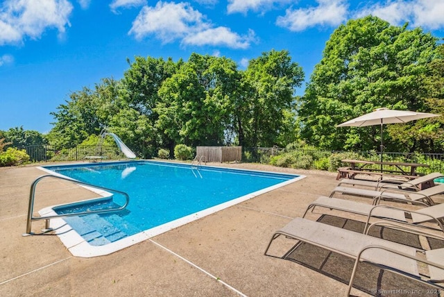 26 Thorson Rd, Oxford, CT 06478 - view of pool with a patio area, view of wooded area, and a diving board