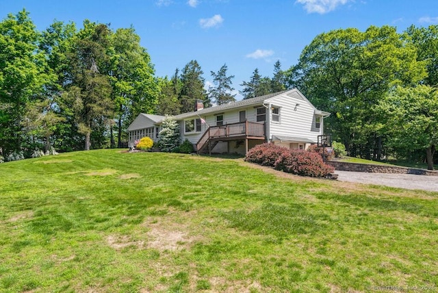 26 Thorson Rd, Oxford, CT 06478 - rear view of house with stairway, a lawn, a deck, driveway, and a chimney