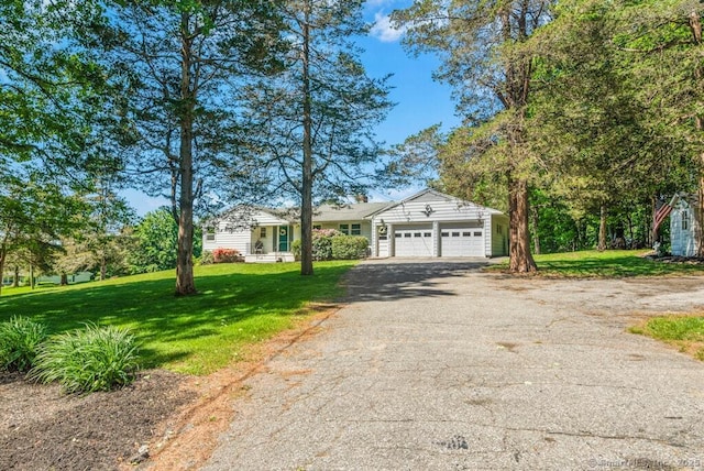 26 Thorson Rd, Oxford, CT 06478 - ranch-style house featuring asphalt driveway, a garage, and a front yard