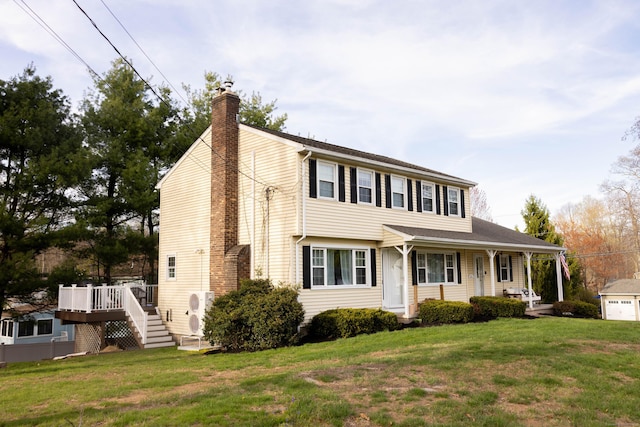 65 Lufkin Ln, Bristol, CT 06010 - view of front facade with a chimney, covered porch, and a front lawn